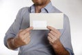 Man holds a letter into the camera Royalty Free Stock Photo