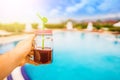 Man holds a mason jar smoothie