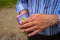 A Man Holds A Miniature Pink Suitcase With Chocolate And Real Euro Notes The Common Currency Of The European Union Royalty Free Stock Photo