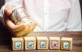 Man holds money above of blocks with permits documents. Artificial bureaucratic obstacles, corruption risks, non-transparent Royalty Free Stock Photo