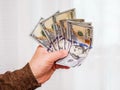 Man holds money in his hand, good profit from the sale of prod Royalty Free Stock Photo