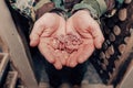 A man holds newborn mice in his hands. Little helpless blind naked creatures