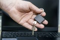 a man holds an open padlock with keys in his hand against the background of a laptop the concept of data protection Royalty Free Stock Photo