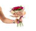 a man holds out a bouquet of flowers. holidays birthdays and weddings. isolated on white Royalty Free Stock Photo