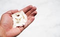 A man holds packets of Swedish nicotine in his hand, snus