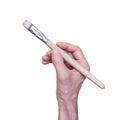 Man holds a paint brush in his hand. Isolated on a white background. Royalty Free Stock Photo