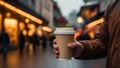 city street, a man holds a paper cup in his hand, a fleeting pause to savor the urban rhythm over a warm beverage