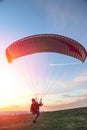 Man holds paraglider slings and prepares to start