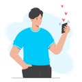 Man holds a phone in his hand, he has received a love message. The concept of web love, online dating. Romantic date video