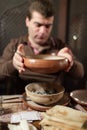 Man holds plate of Khash