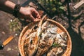 A man holds a plate with a ready meal. delicious and fresh grilled fish with lemon on the Barbeque grill at the garden Royalty Free Stock Photo