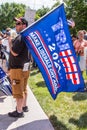 Man Holds a Pro-Trump Sign That Reads `Make Liberals Cry`