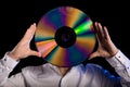 Man holds retro laser disc Royalty Free Stock Photo