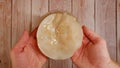 Man holds Scoby for Kombucha in his hand