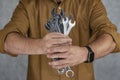 Man holds a set keys for car repair Royalty Free Stock Photo