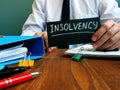 Man holds sign insolvency about bankruptcy