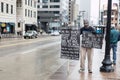 Man Holds Sign with Names of those Killed by Police at the Ohio Statehouse Ahead of Biden`s Inauguration