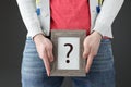 Man holds sign with question mark closeup Royalty Free Stock Photo