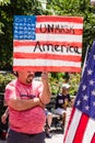 A Man Holds a Sign that Says Unmask America Royalty Free Stock Photo