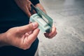 Man holds stack of Lebanese liras