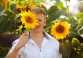 Man holds sunflower in front of face Royalty Free Stock Photo