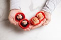 Man holds sushi different roll pieces in hands