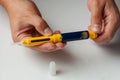 A man holds a syringe for subcutaneous injection of hormonal drugs in the IVF protocol in vitro fertilization Royalty Free Stock Photo