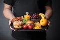 man holds a tray of organic products and fast food, Healthy and junk food, Diet decision concept, Generative AI