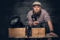 A man holds vintage camera.