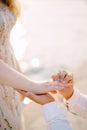 Man holds a woman hand with a engagement ring. Close-up Royalty Free Stock Photo