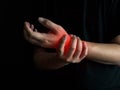 Man holds he wrist hand injury, feeling pain. Health care and medical conept Royalty Free Stock Photo