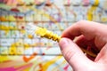 Man holds yellow network internet cable on laptop background Royalty Free Stock Photo