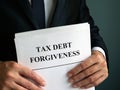 Man holds Tax debt forgiveness agreement