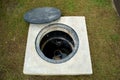 A man hole water and a hole of grease trap with the drain system around the house. Royalty Free Stock Photo