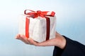 Man holiday a gift on his hand Royalty Free Stock Photo