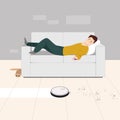 A man at home lying on the couch turns on the robot vacuum cleaner from the phone