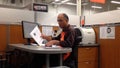 Man of Homedepot worker collecting some files