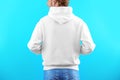 Man in hoodie sweater on color background Royalty Free Stock Photo
