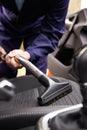 Man Hoovering Seat Of Car During Car Cleaning Royalty Free Stock Photo