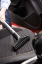 Man Hoovering Seat Of Car During Car Cleaning Royalty Free Stock Photo