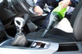 Man Hoovering Seat Of Car During Car Cleaning Royalty Free Stock Photo