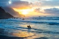 Man horse riding on sunset beach Royalty Free Stock Photo