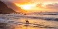 Man horse riding on sunset beach Royalty Free Stock Photo