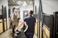 Man with horse in the stable Royalty Free Stock Photo