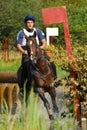 Man horsebak on galloping brown chestnut horse