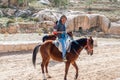 Man on horses on road to Rose City knows also as Petra. Petra is one of the New Seven Wonders of Royalty Free Stock Photo