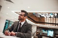 Man in Hotel check in at reception or front office, fulfills his profile Royalty Free Stock Photo