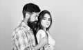 Man hug pretty woman. Bearded hipster cuddle with brunette girl. Feel his passion. Tender touch. Sensual couple in love Royalty Free Stock Photo