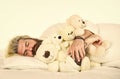 Man hug toy relaxing in bed. Good vibes. Imaginary friends. Strive to practice good sleep habits. Cute teddy bear toy Royalty Free Stock Photo