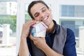 Man hugging house model made money Royalty Free Stock Photo